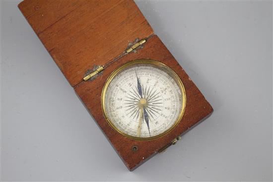 An early 19th century mahogany cased pocket compass, the dial marked in quadrants of ten degree divisions, the case 5cms sq.